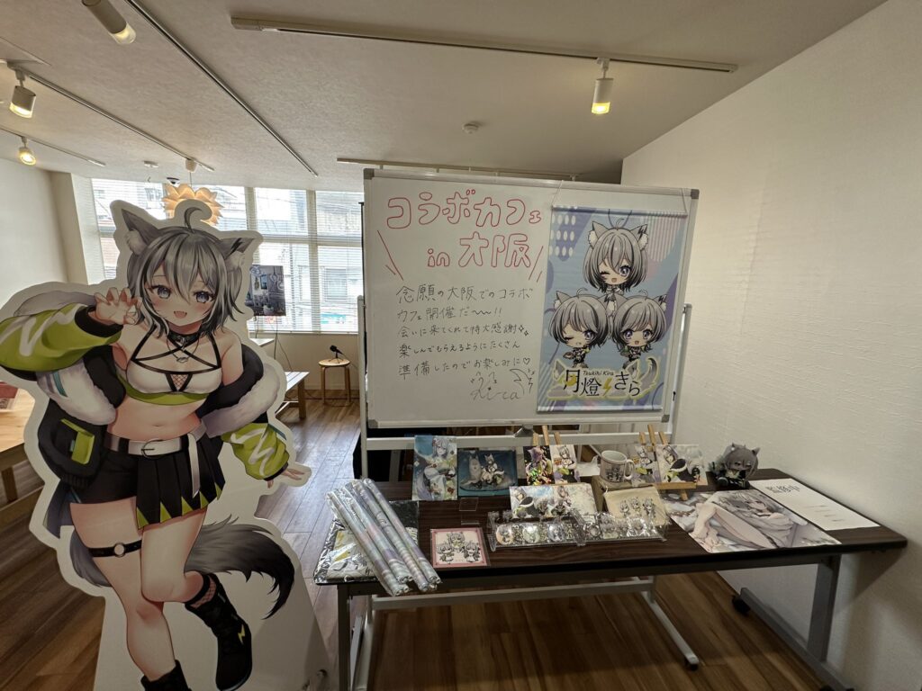 制作事例:月燈きら様等身大パネルとグッズが並べられている様子